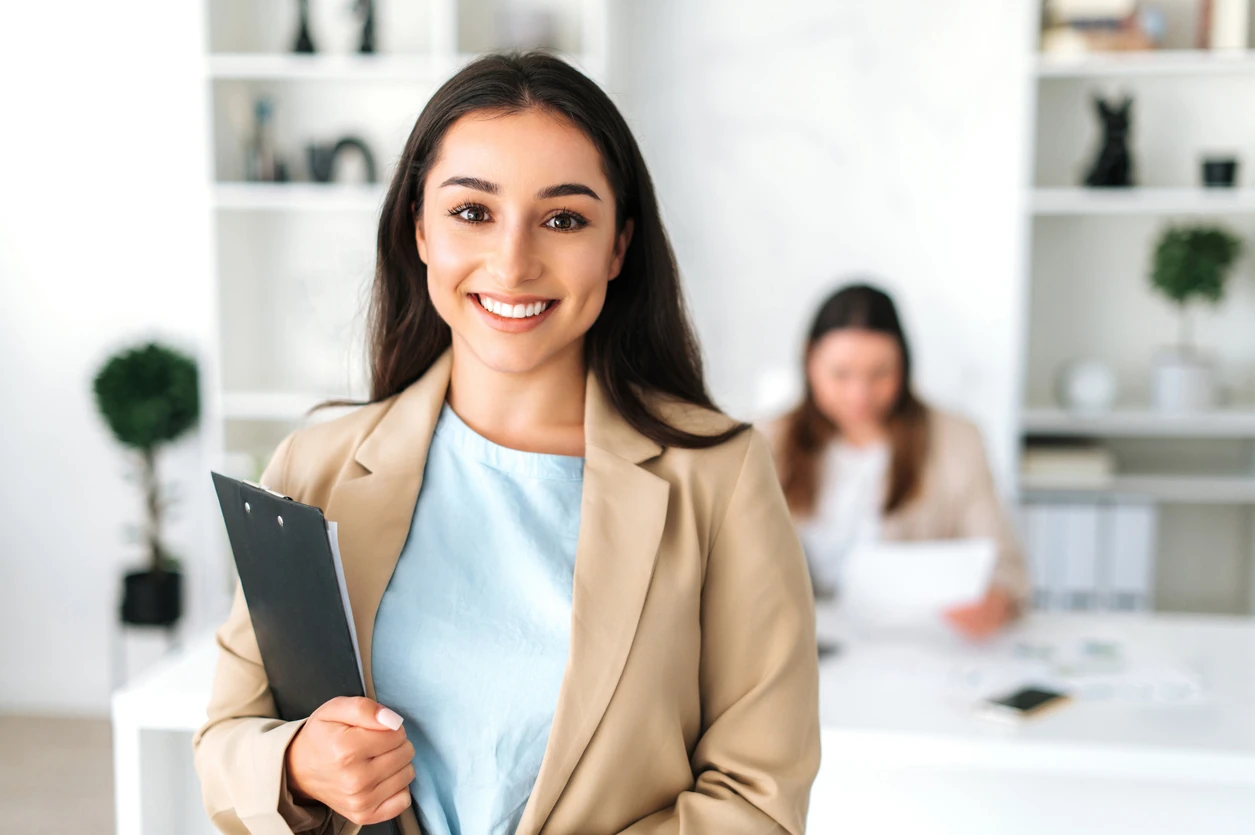 business woman, secretary, company ceo, in a elegant suit stand in a modern office